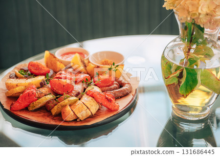 Grilled Sausages with Vegetables and Dipping Sauces Grilled Sausages with Vegetables and Dipping Sauces 131686445