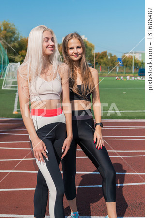 Two athlete young woman runner at the stadium 131686482