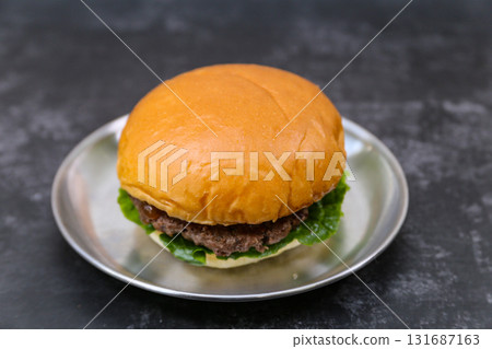 beef patty hamburger on a plate 131687163