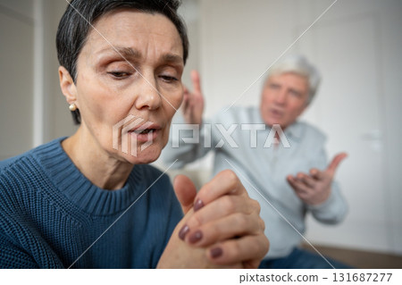 Depressed exhausted woman in silent protest against angry husband. Unhappiness, conflict stress 131687277