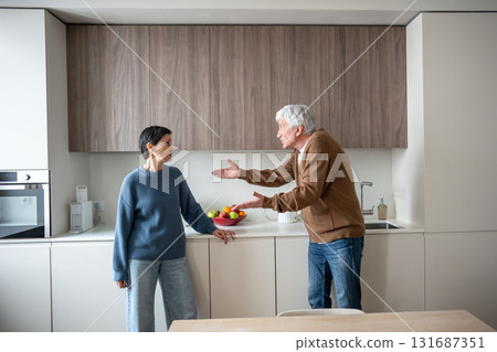 Agitated elderly couple argues yells nearly fights accusing humiliating each other. Toxic conflict 131687351