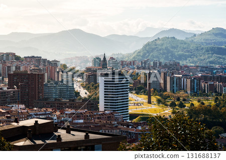 Bilbao cityscape featuring modern architecture and traditional buildings under sunlight. 131688137