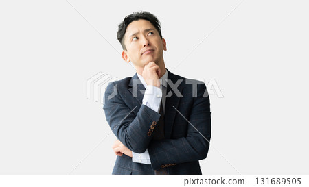 A male businessman thinking 131689505