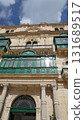 View of old building with windows, balconies in city. Republic of Malta, the picturesque city Valetta, Malta. 131689517