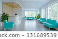 Bright waiting area with teal seating and large windows offering a view of the outside greenery 131689539