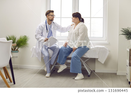 Doctor talking about treatment to woman patient, supporting and calming her down 131690445
