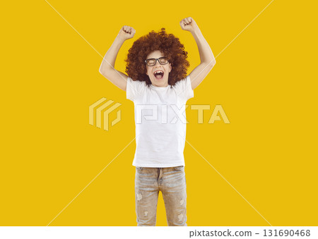 Happy funny little child standing on color background, raising hands up and screaming Happy funny little child standing on color background, raising hands up and screaming 131690468