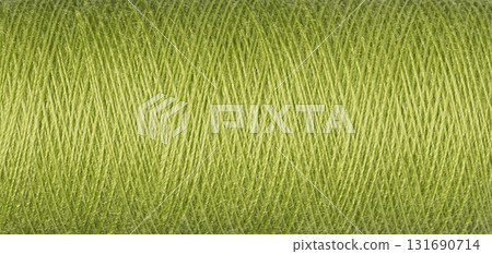 macro texture of a skein of green sewing thread 131690714