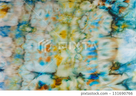 abstract pattern on silk fabric texture in blue, yellow, green colors abstract pattern on silk fabric texture in blue, yellow, green colors 131690766