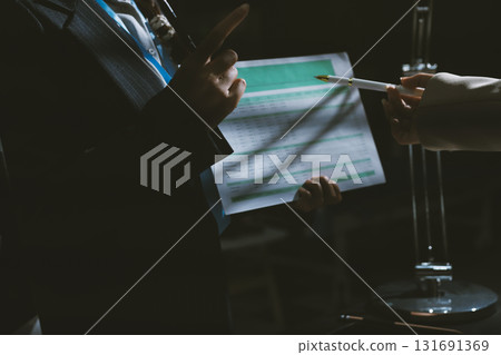 Close up high angle Asian businesswoman working with her coworker in meeting room 131691369