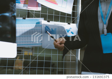 Close up high angle Asian businesswoman working with her coworker in meeting room 131691375