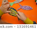 Craft a fish model from cardboard, thread, and paint, with detailed steps, on an orange background. 131691461