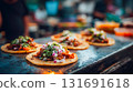 Delicious tacos with fresh toppings on a metal surface. Close-up shot of several tacos, each filled with meat and topped with fresh cilantro, onions, and other ingredients This is AI-generated item 131691618