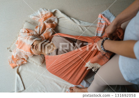 Individual receiving gentle support during a wellness session in a tranquil indoor setting with calming colors and natural light in the early afternoon 131692058