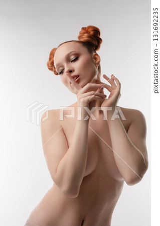Topless beauty woman posing gracefully in a studio setting 131692235
