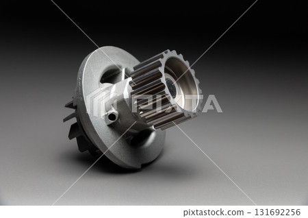 Top-quality parts for your car. Car maintenance. New water pump for a car's engine cooling system on a gray gradient background. Top-quality parts for your car. Car maintenance. New water pump for a car's engine cooling system on a gray gradient background. 131692256