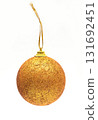 Golden glitter Christmas ball ornament hanging on a string on a white background. Classic festive decoration 131692451