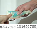 Handing over cash, russian rubles. 131692765