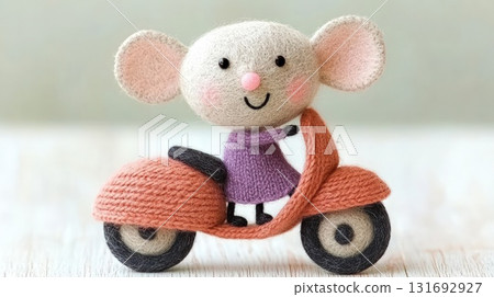 Adorable knitted mouse, wearing purple dress, enjoys leisurely ride on orange scooter 131692927