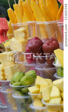 Tropical fruit cups set of summer lemonades in plastic cups for takeaway, colourful Lemonade in transparent cup, Lemonade to go cup with different fruits cocktail 131693348