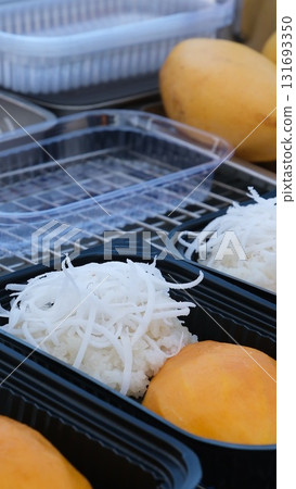 Ripe Mango Sticky Rice with Coconut Milk on wood background.Traditional Thai Dessert 131693350