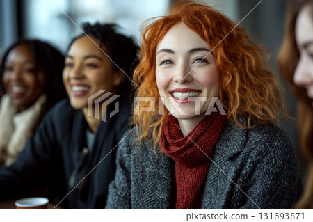 A smiling woman with red hair in a cozy setting, surrounded by others. Concept of happiness and friendship. For community or group event photos. A smiling woman with red hair in a cozy setting, surrounded by others. Concept of happiness and friendship. For community or group event photos. 131693871