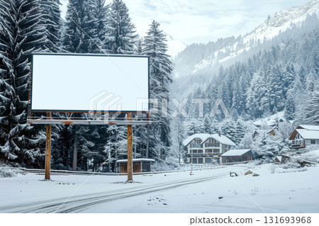 Large blank billboard stands in a snowy forest near several houses. Concept of winter advertising space. For winter-themed marketing. 131693968