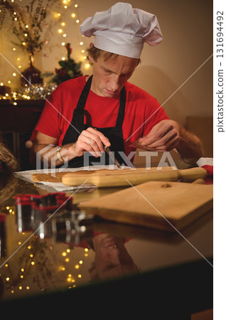 Chef In White Hat Preparing Dough At Festive Kitchen For Christmas Cooking Scene 131694492
