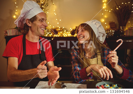 Happy Chefs Share Holiday Joy In Cozy Kitchen As They Bake And Laugh Happy Chefs Share Holiday Joy In Cozy Kitchen As They Bake And Laugh 131694546