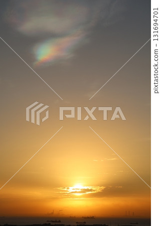 Rainbow clouds and the rising sun 131694701