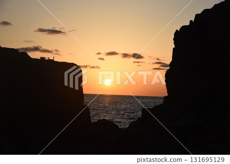 Sunset seen from the rocks 131695129