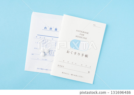 Medicine notebook and medicine on a light blue background 131696486