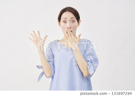 Woman middle-aged surprised white background 131697294