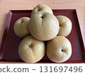 Pears on a wooden plate 131697496