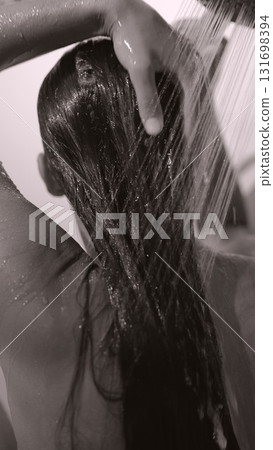 A Relaxing Shower Scene Featuring Beautiful Flowing Hair with Refreshing Water and Serenity A Relaxing Shower Scene Featuring Beautiful Flowing Hair with Refreshing Water and Serenity 131698394
