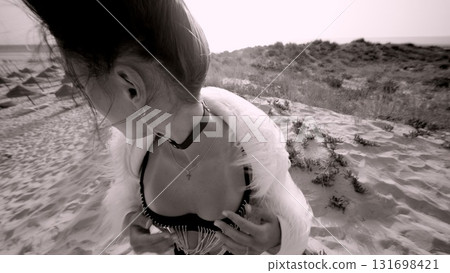 Captivating Fashionable Beach Shoot Embracing Elegance in Stunning Monochrome Colors 131698421