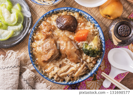 Stir fried chicken and mushroom over rice  131698577