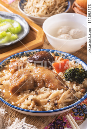 Stir fried chicken and mushroom over rice  131698578