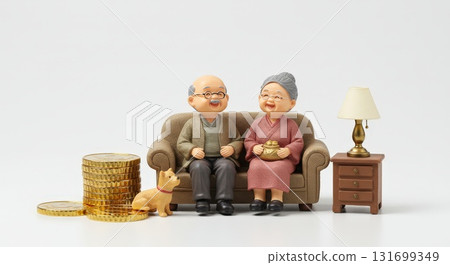 A miniature figure of an elderly person enjoying a comfortable life in retirement thanks to the rise in gold prices and investment. 131699349