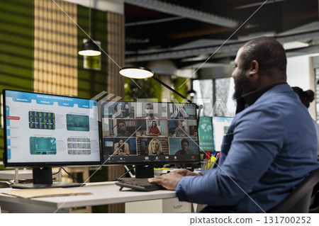 Black businessman meets on online call event to discuss project development with the shareholders, developing a fruitful partnership. Web chat video conferencing for innovation. Black businessman meets on online call event to discuss project development with the shareholders, developing a fruitful partnership. Web chat video conferencing for innovation. 131700252