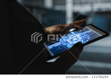 Closeup of computer scientist using AI in data center to track metrics of gear used to host websites. Server hub worker uses machine learning to upgrade rigs running companies databases 131700293
