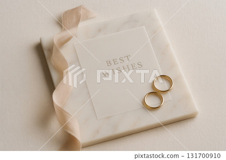 Elegant Wedding Flat Lay With Best Wishes Card, Gold Rings And Blush Ribbon On Marble Elegant Wedding Flat Lay With Best Wishes Card, Gold Rings And Blush Ribbon On Marble 131700910