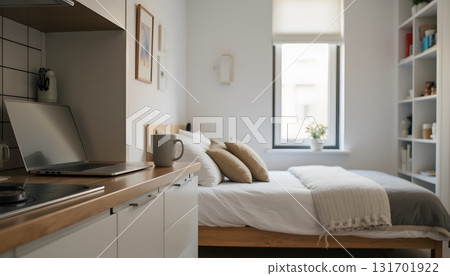 Cozy Modern Bedroom with Warm Decor and Work Desk in Bright Natural Light Cozy Modern Bedroom with Warm Decor and Work Desk in Bright Natural Light 131701922