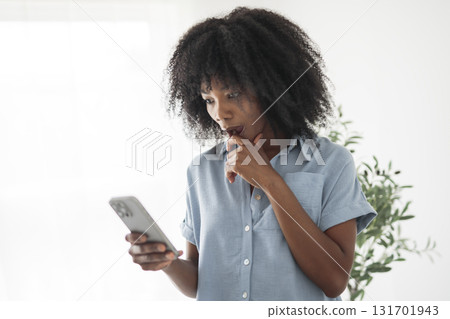 black business mature woman using cellphone on white background black business mature woman using cellphone on white background 131701943