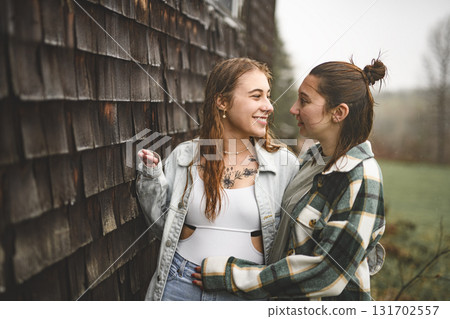 Lesbian Couple Together Outdoors in a rainy day 131702557