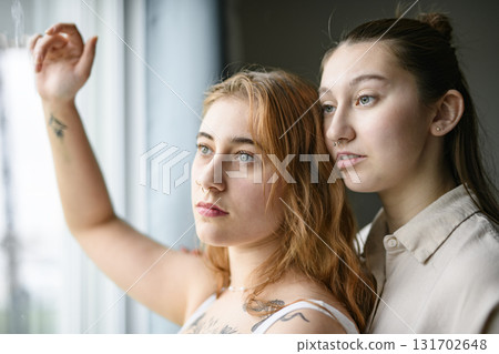Happy couple having great time close to a window at home 131702648