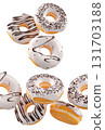 Donuts with white chocolate glaze, sprinkles, white drizzle, and dots isolated on white transparent background 131703188