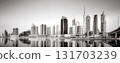 Skyscrapers and bridge over water, black and white style, city background, Dubai Marina bay UAE 131703239