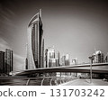 Skyscrapers and bridge over water, black and white style, city background, Dubai Marina bay UAE 131703242