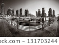 Skyscrapers and bridge over water, black and white style, city background, Dubai Marina bay UAE 131703244